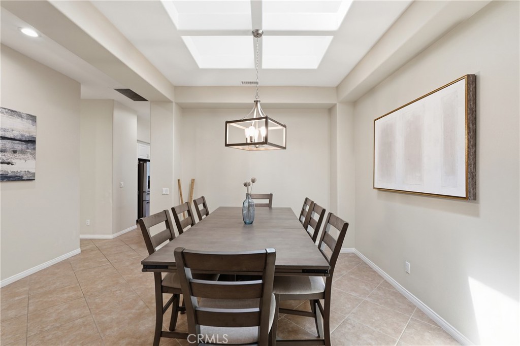 9 Orleans Road Rancho Mirage, CA 92270 - Photo 25 of 71 a view of a dining room with furniture and wooden floor