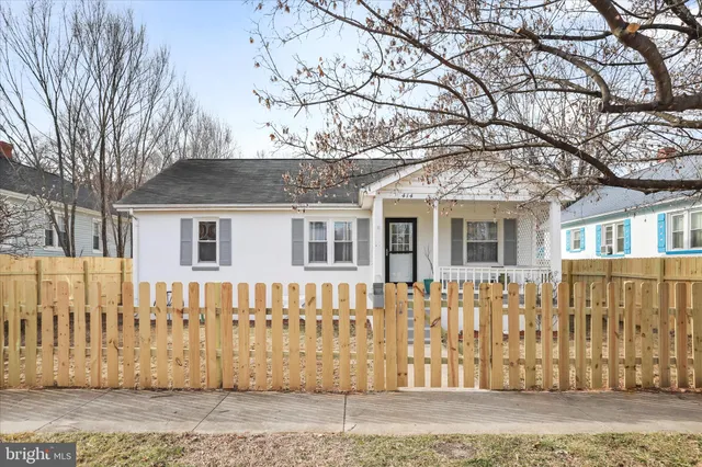 a front view of a house with a fence