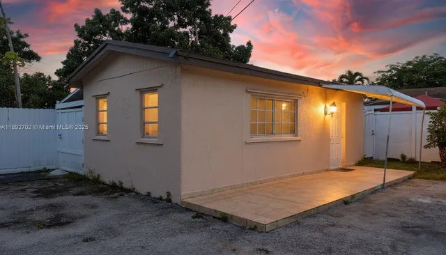 a backyard of a house with wooden deck