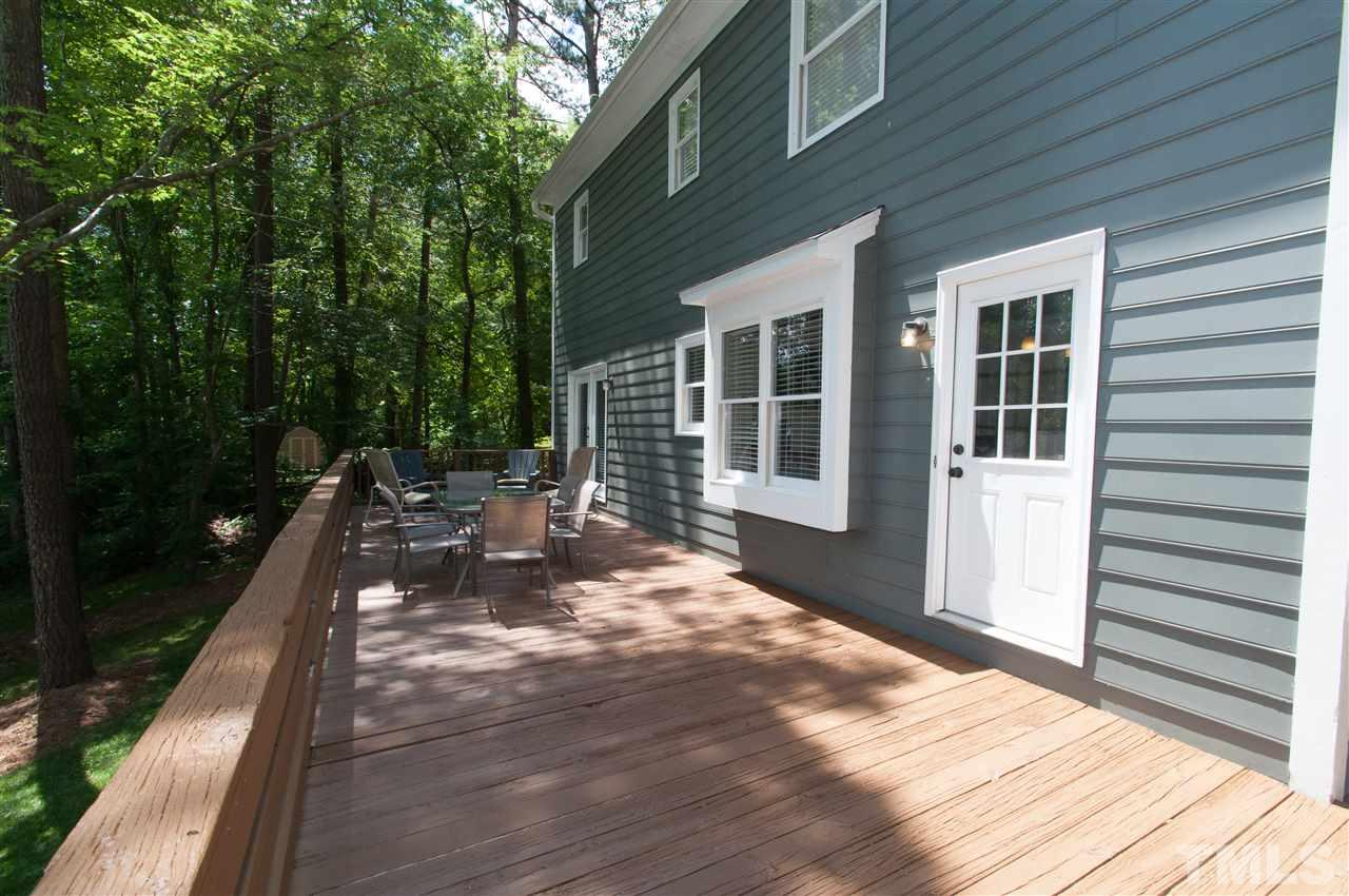 7304 Chicora Court Raleigh, NC 27615 - Photo 17 of 25 a view of a house with backyard sitting area and garden