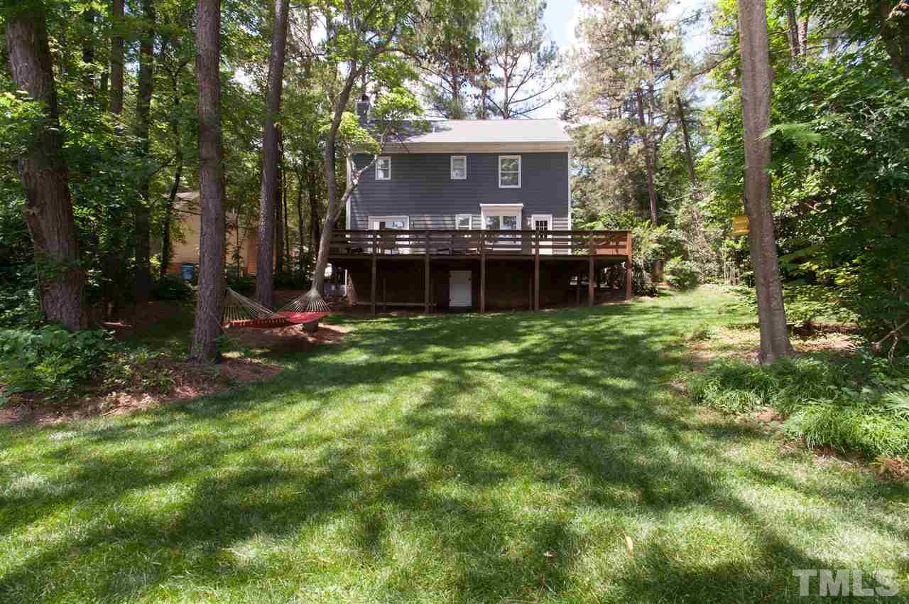 7304 Chicora Court Raleigh, NC 27615 - Photo 19 of 25 a view of a house with backyard and sitting area