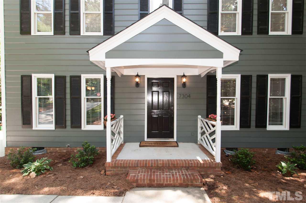 7304 Chicora Court Raleigh, NC 27615 - Photo 20 of 25 a front view of a house with garden