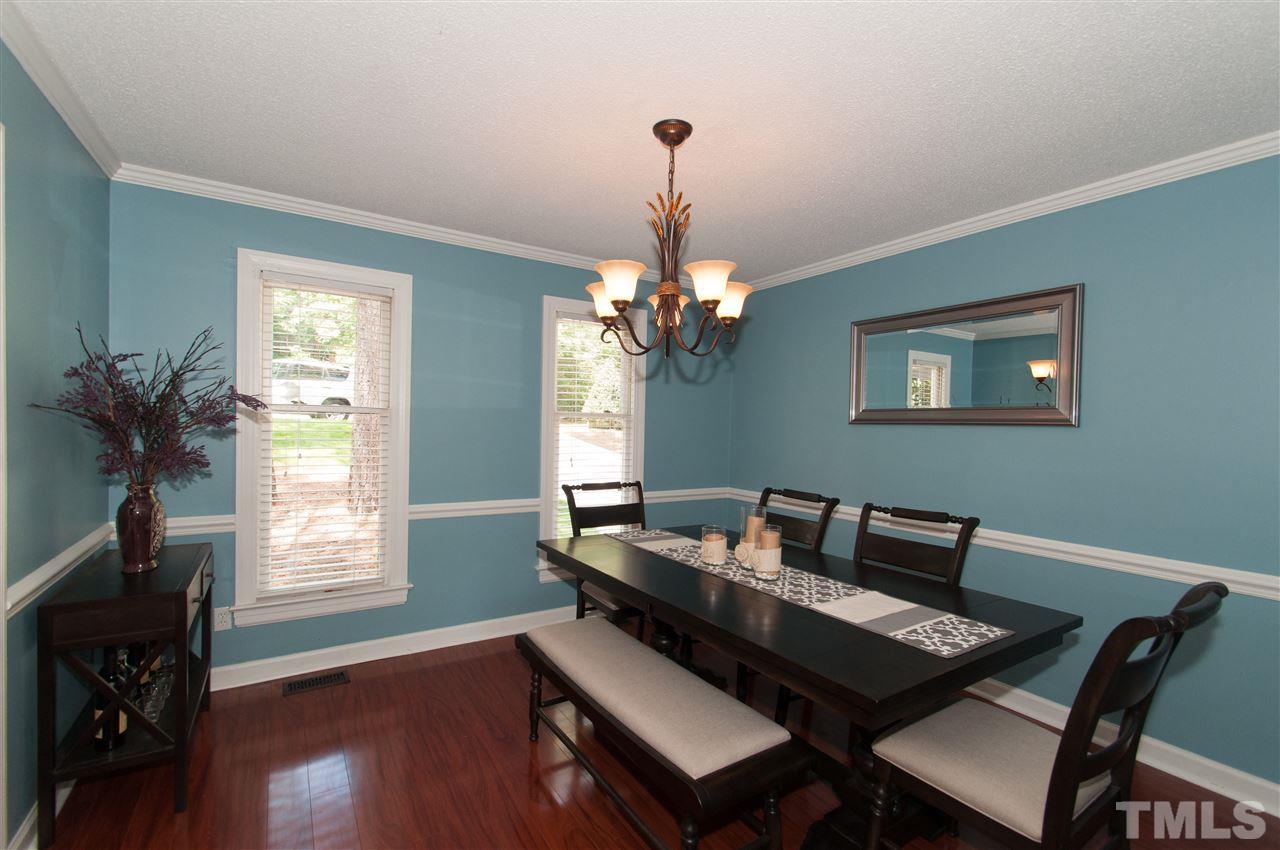 7304 Chicora Court Raleigh, NC 27615 - Photo 5 of 25 a living room with furniture and a window