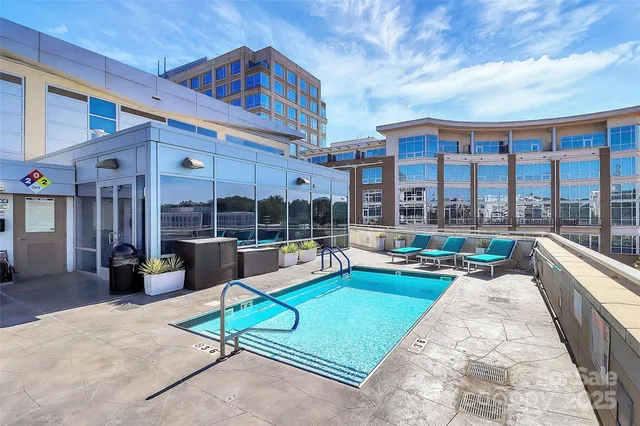 a view of a patio with swimming pool table and chairs