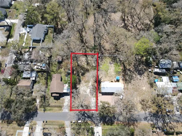 an aerial view of residential house with outdoor space
