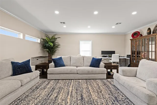 a spacious bathroom with a granite countertop sink a toilet and a bathtub