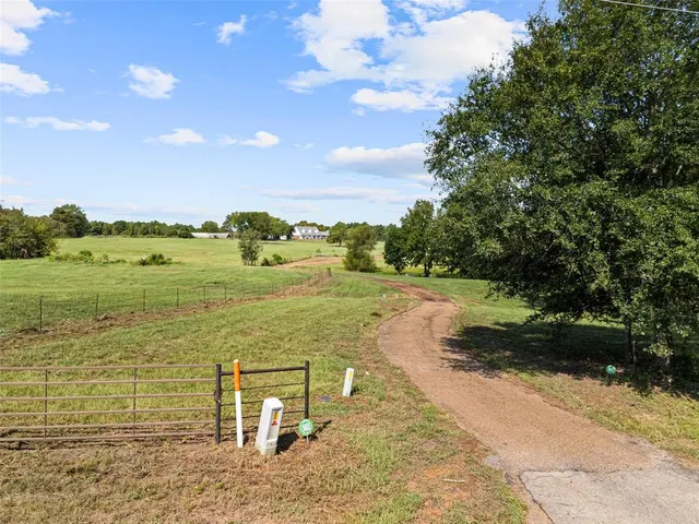 a view of a lake with a yard