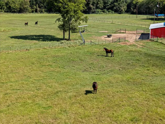 a view of a big house with a big yard