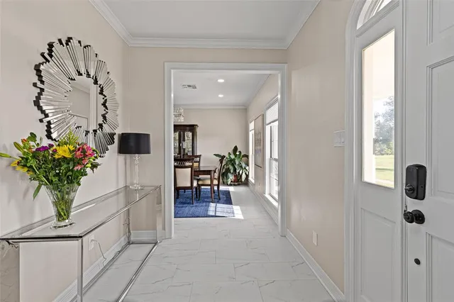 a living room with furniture and a ceiling fan
