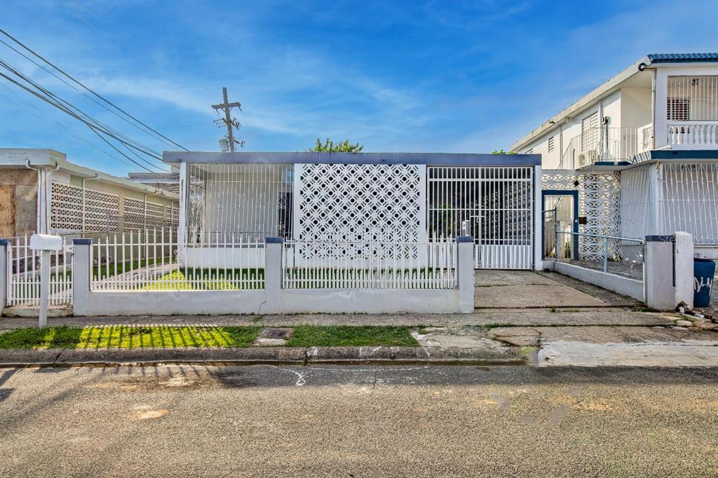 41 St An-5 Bayamon Prairie Bayamon, PR 00956 - Photo 1 of 1 a view of a street with a car parked on the road