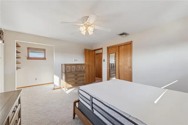 an empty room with closet area