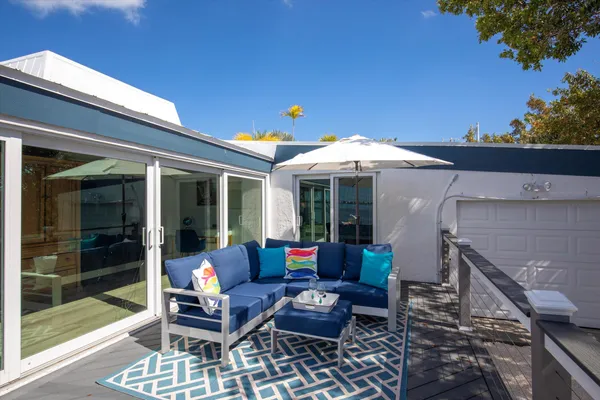 a view of a room with wooden floor and outdoor space