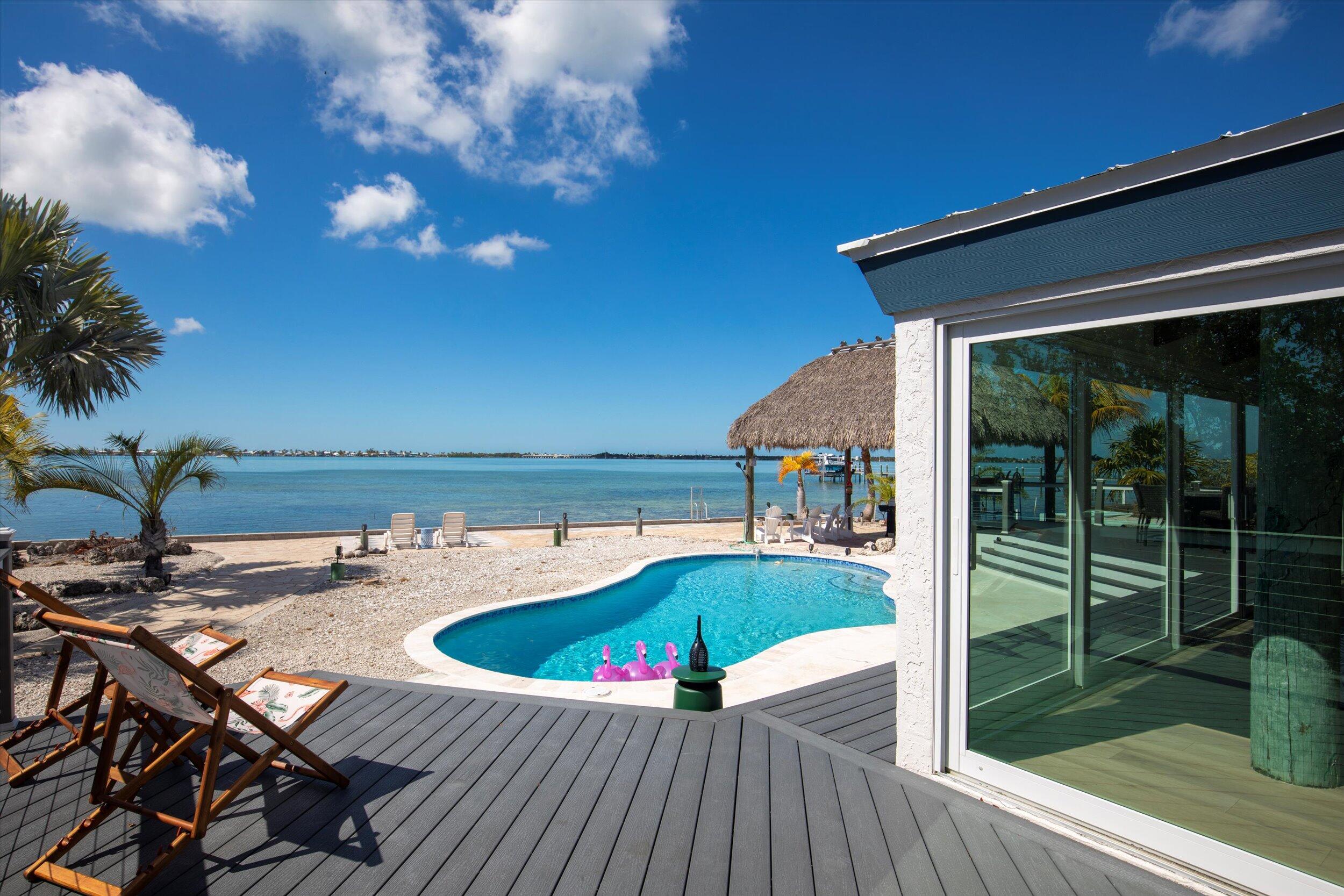 29581 Richard Road Big Pine Key, FL 33043 - Photo 13 of 78 a view of a swimming pool with a patio