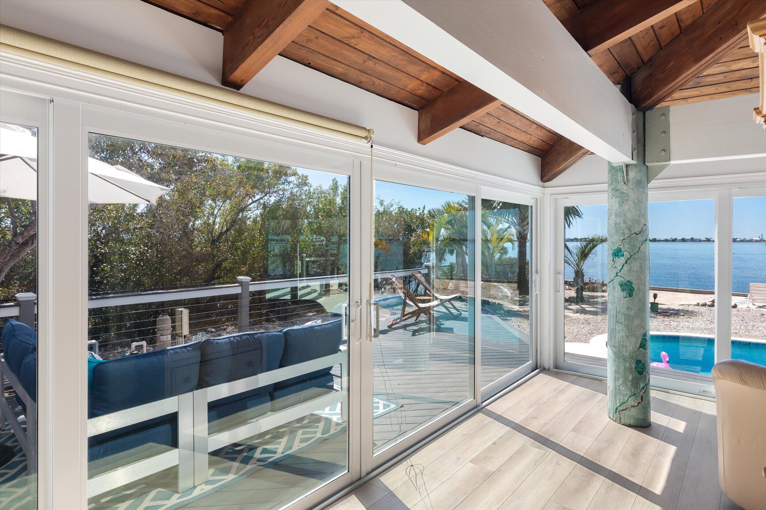 29581 Richard Road Big Pine Key, FL 33043 - Photo 24 of 78 a view of a room with wooden floor and outdoor space