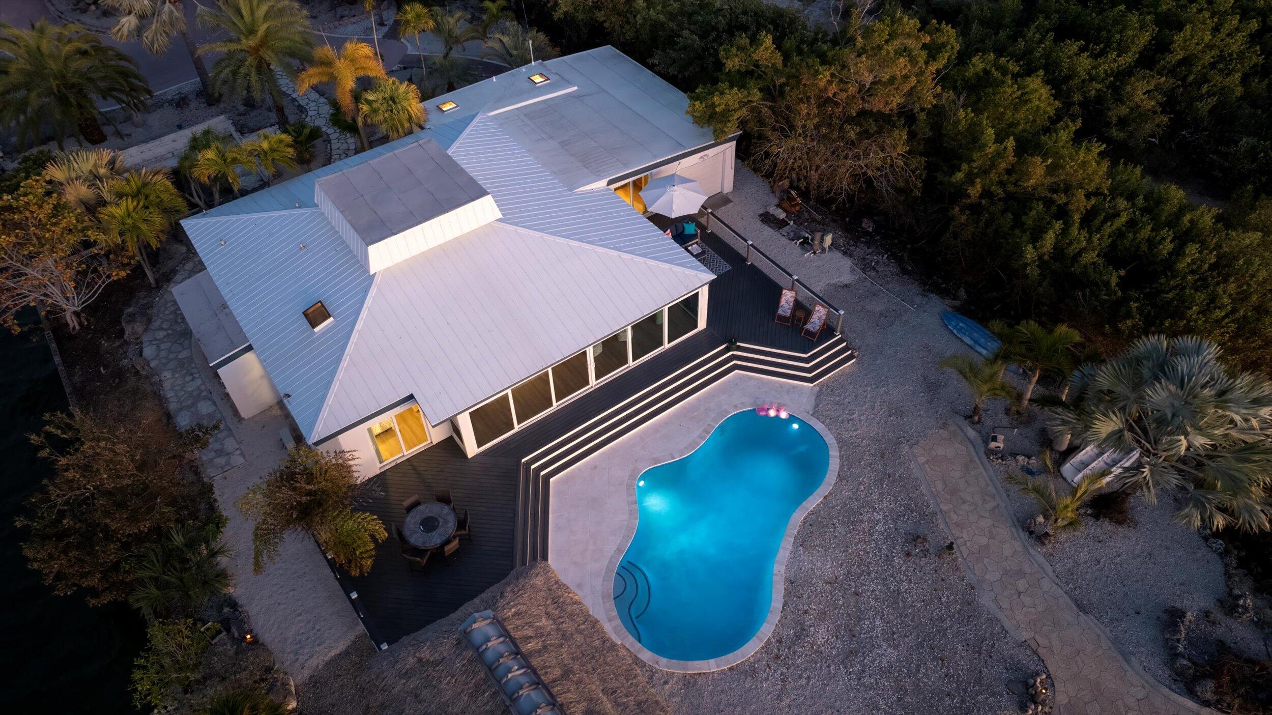29581 Richard Road Big Pine Key, FL 33043 - Photo 3 of 78 an aerial view of a house with a swimming pool and a yard