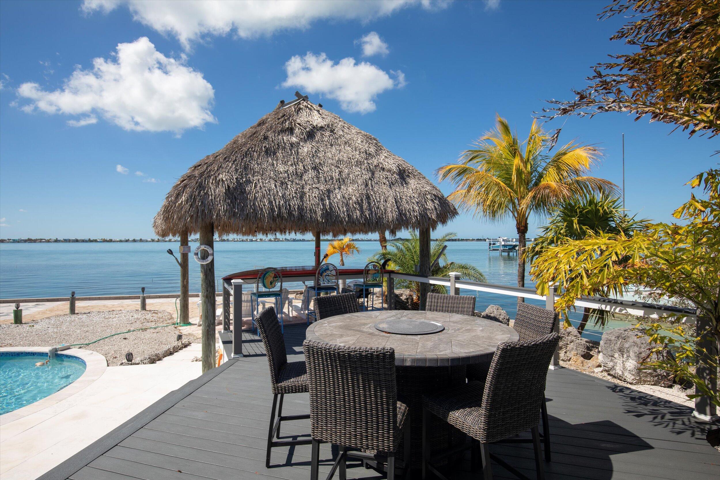 29581 Richard Road Big Pine Key, FL 33043 - Photo 10 of 78 a view of an outside dining space with furniture