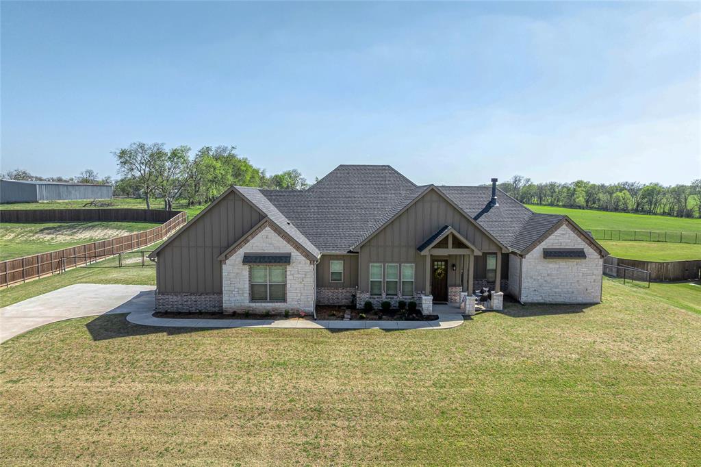 1065 Old Highway Howe, TX 75459 - Photo 1 of 39 Craftsman-style home with board and batten siding, stone siding, covered porch, and a shingled roof