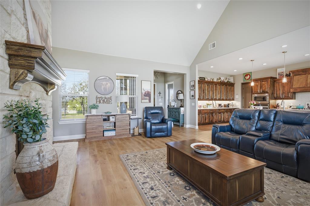 1065 Old Highway Howe, TX 75459 - Photo 11 of 39 Living room with light wood-style floors, lofted ceiling, and recessed lighting