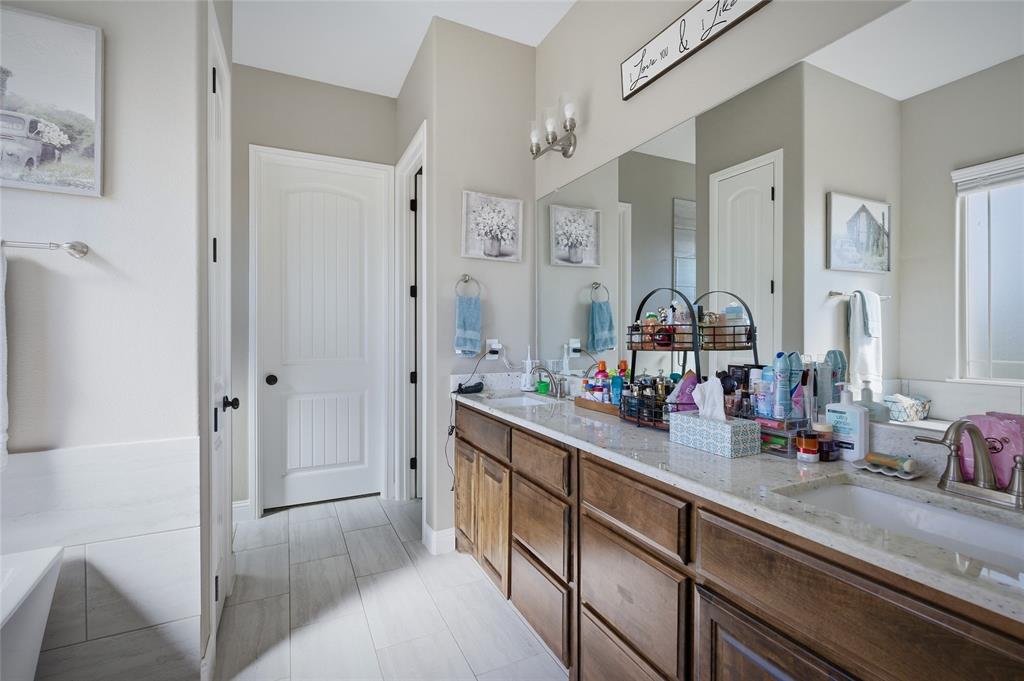 1065 Old Highway Howe, TX 75459 - Photo 22 of 39 Bathroom featuring double vanity and a tub to relax in