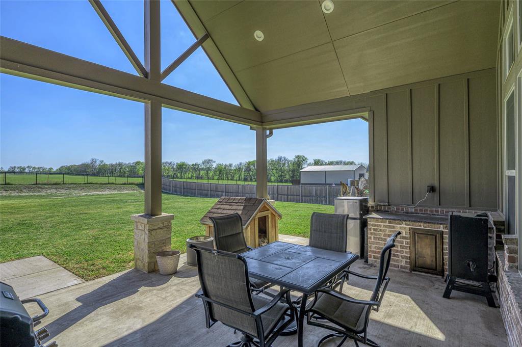 1065 Old Highway Howe, TX 75459 - Photo 29 of 39 Fenced backyard featuring a patio and outdoor dining space