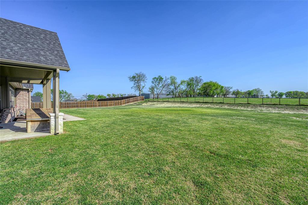 1065 Old Highway Howe, TX 75459 - Photo 31 of 39 Fenced backyard with a patio
