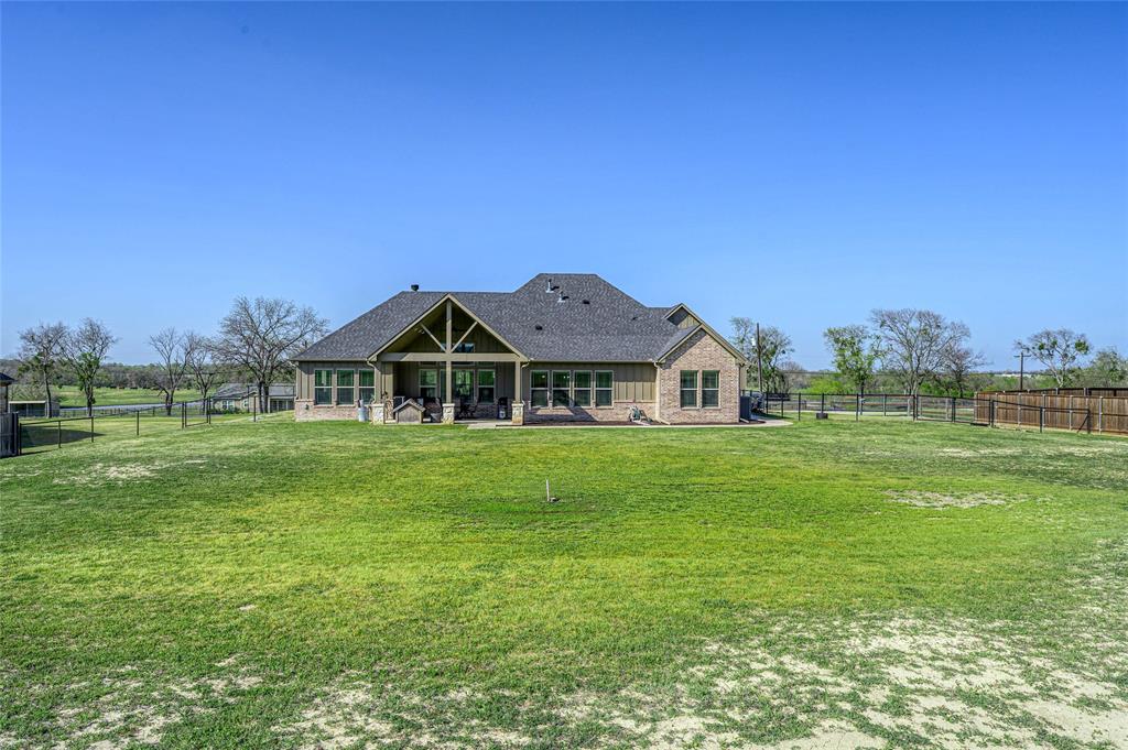 1065 Old Highway Howe, TX 75459 - Photo 33 of 39 Rear view of house featuring a patio, a fenced backyard, and brick siding