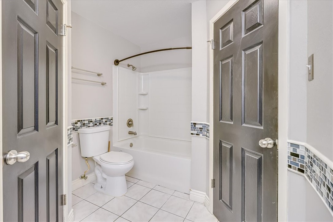 2938 River Crest Road Corpus Christi, TX 78415 - Photo 23 of 39 a bathroom with a toilet and a shower