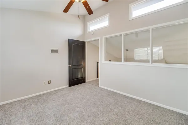 a front view of a house with a garden and yard