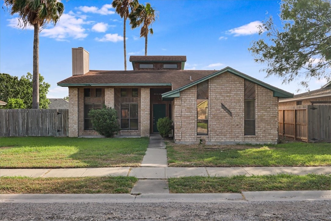 2938 River Crest Road Corpus Christi, TX 78415 - Photo 33 of 39 a front view of a house with a garden and yard