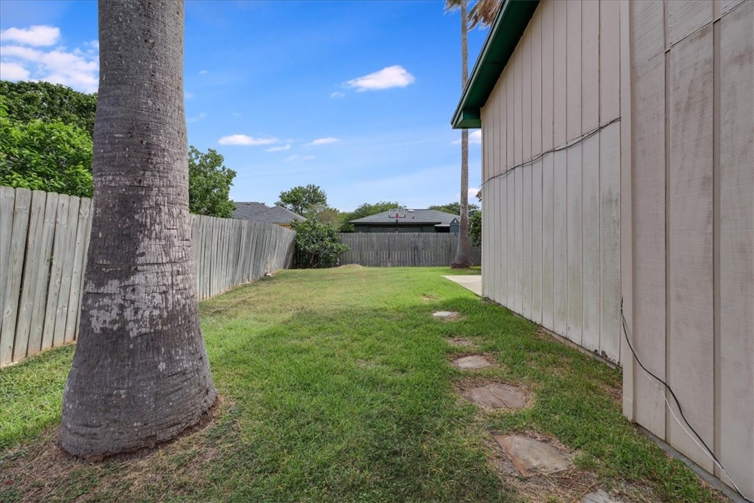 2938 River Crest Road Corpus Christi, TX 78415 - Photo 35 of 39 a view of a garden with a fountain