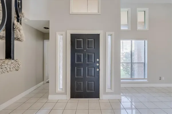 a view of an entryway with front door