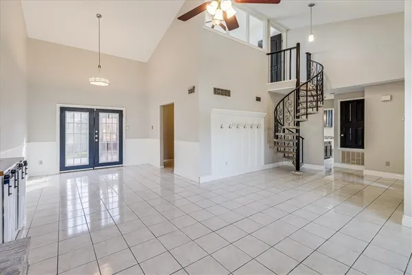 a view of entryway and hall with a chandelier