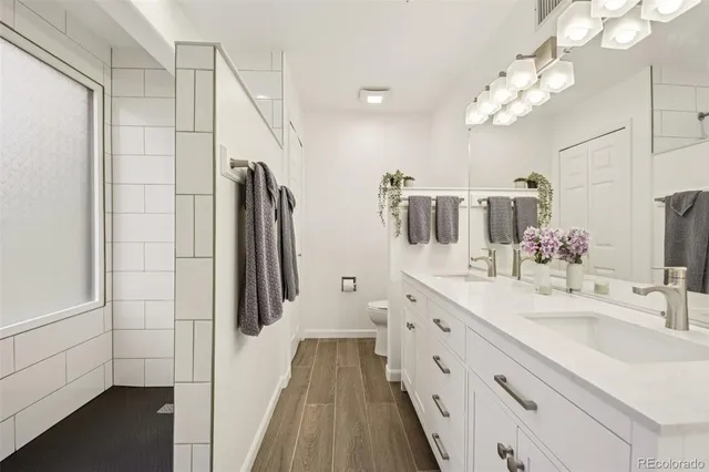 a bathroom with a sink a double vanity and a mirror