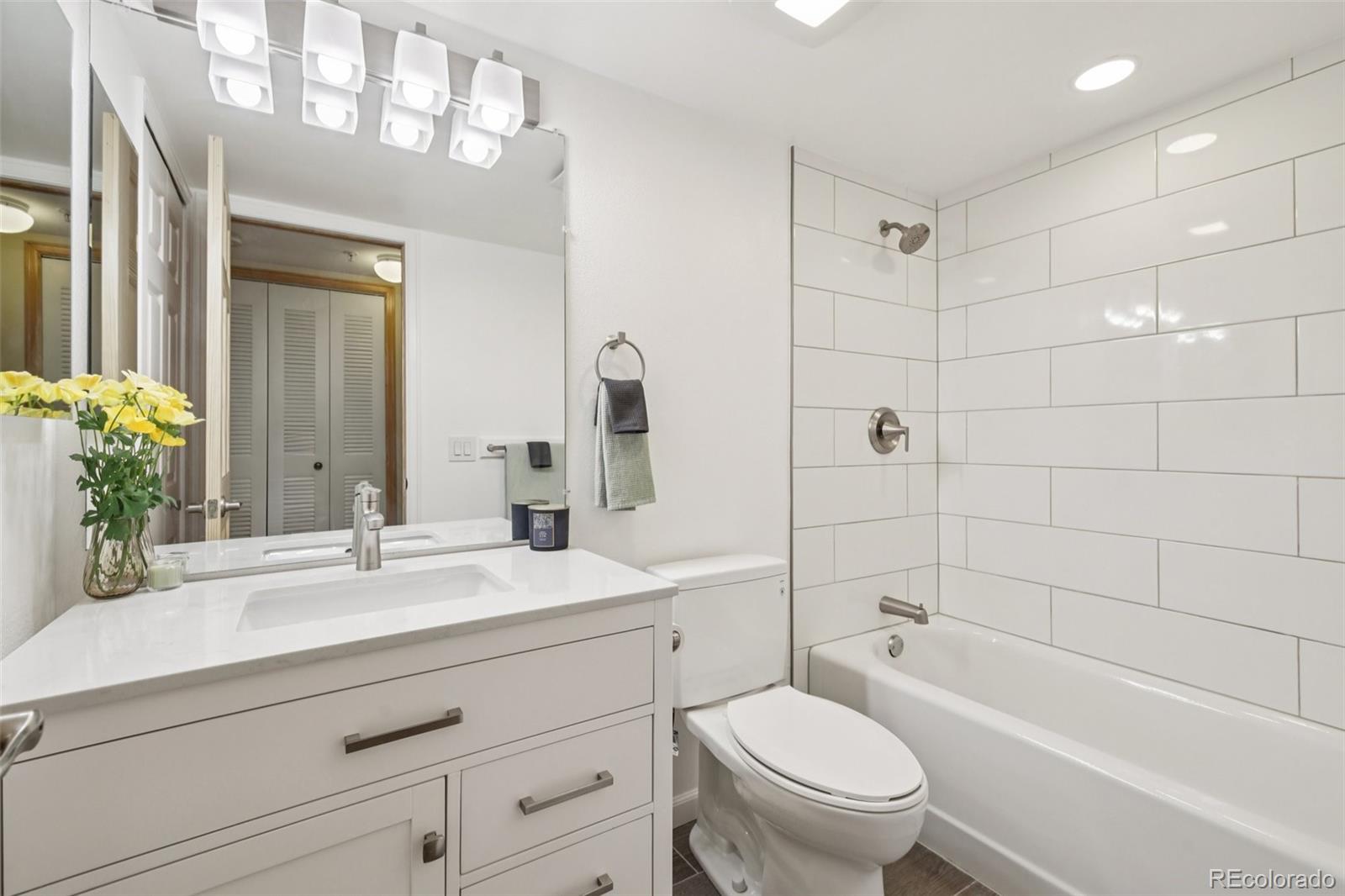 23674 Pondview Place, Unit B Golden, CO 80401 - Photo 19 of 35 a bathroom with a sink a toilet and shower
