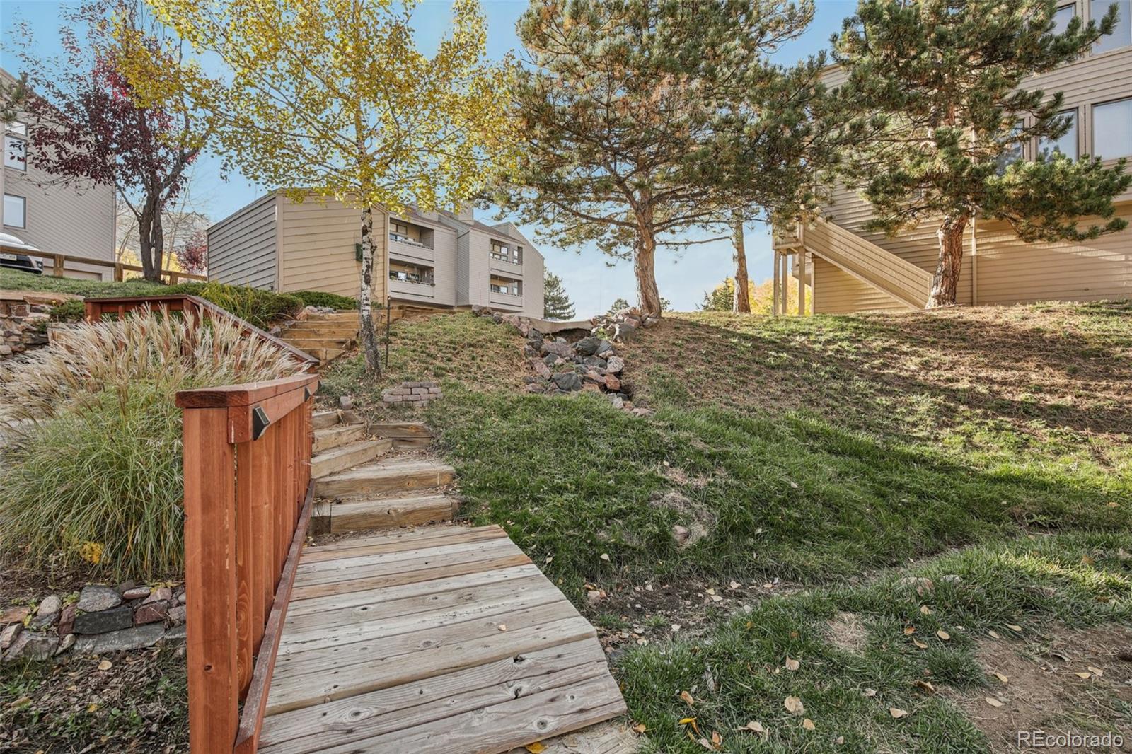 23674 Pondview Place, Unit B Golden, CO 80401 - Photo 28 of 35 a front view of a house with a yard