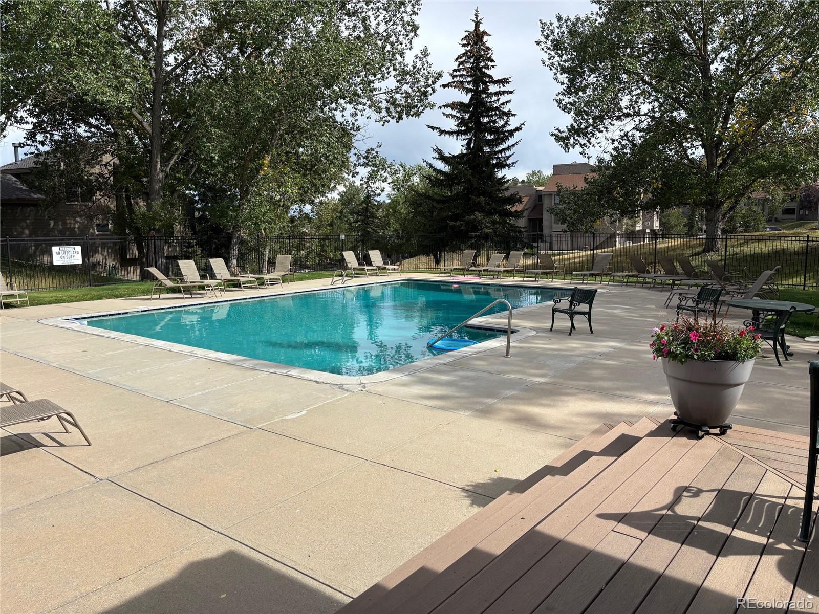 23674 Pondview Place, Unit B Golden, CO 80401 - Photo 29 of 35 a view of a swimming pool with a patio