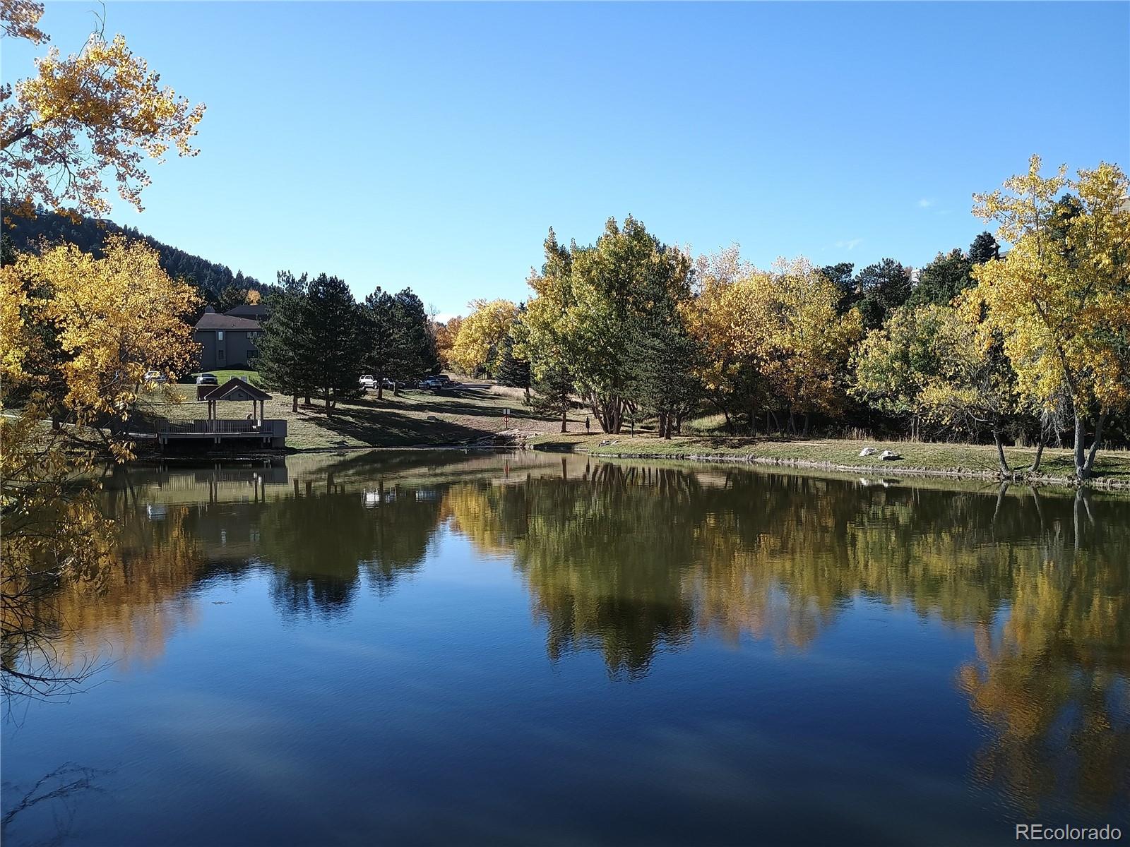 23674 Pondview Place, Unit B Golden, CO 80401 - Photo 30 of 35 a view of a lake with houses