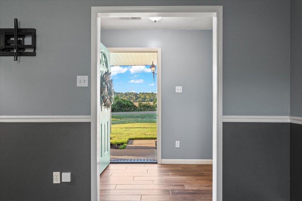 9496 Holly Grove Road Brighton, TN 38011 - Photo 5 of 29 Entryway with wood finished floors and baseboards