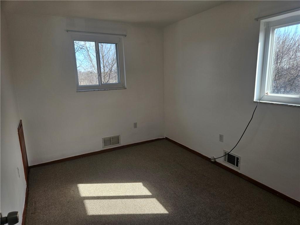 812 Westbury Road, Unit B North Versailles, PA 15137 - Photo 14 of 29 an empty room with a window