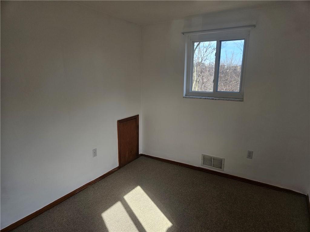 812 Westbury Road, Unit B North Versailles, PA 15137 - Photo 15 of 29 an empty room with windows