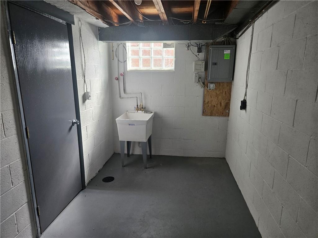 812 Westbury Road, Unit B North Versailles, PA 15137 - Photo 23 of 29 a view of a hallway with wooden shelves