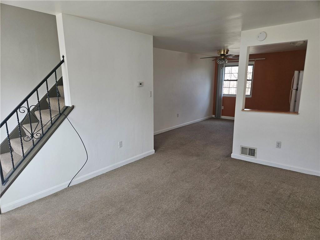 812 Westbury Road, Unit B North Versailles, PA 15137 - Photo 4 of 29 an empty room with windows and entrance