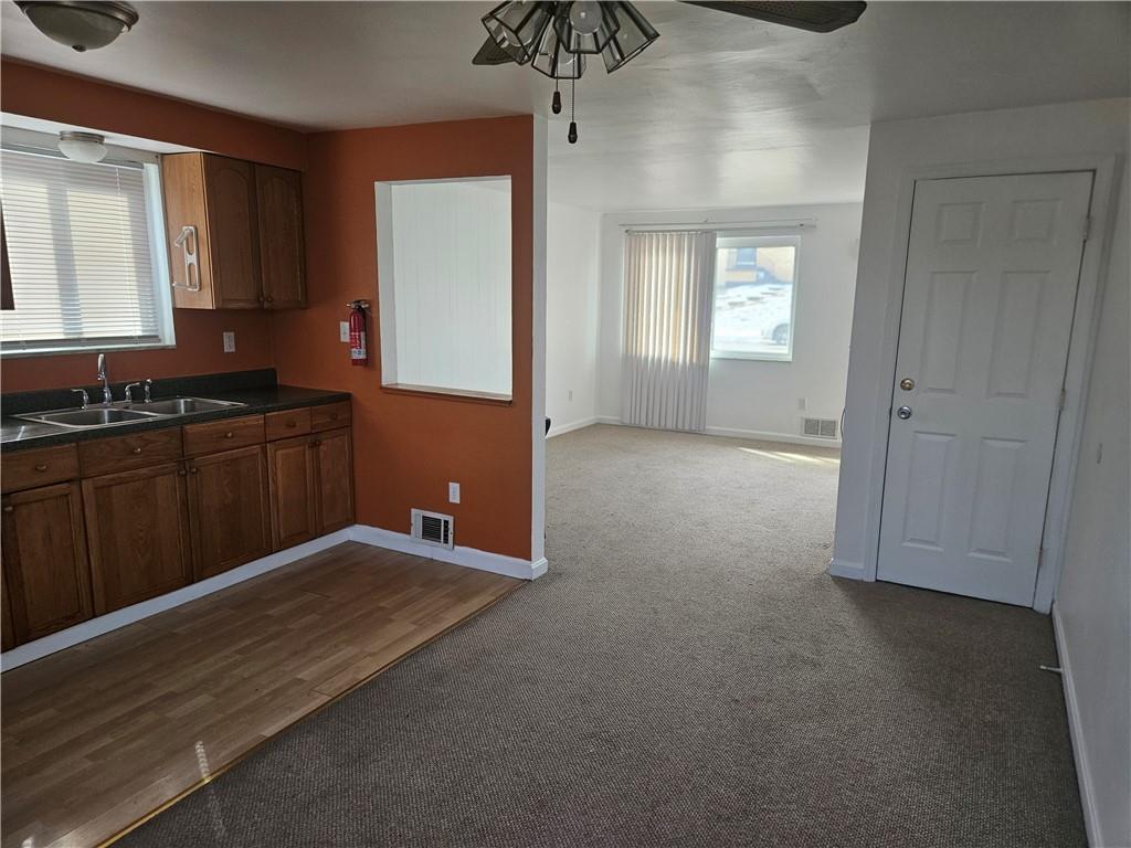 812 Westbury Road, Unit B North Versailles, PA 15137 - Photo 10 of 29 a view of kitchen with granite countertop cabinets and wooden floor