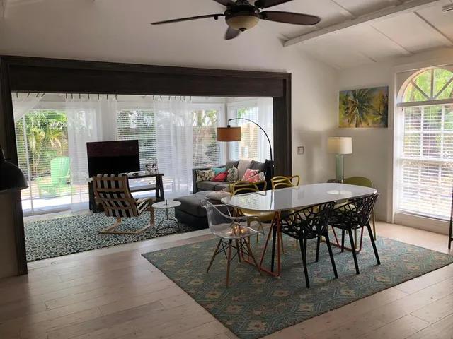 a view of a dining room with furniture window and outside view