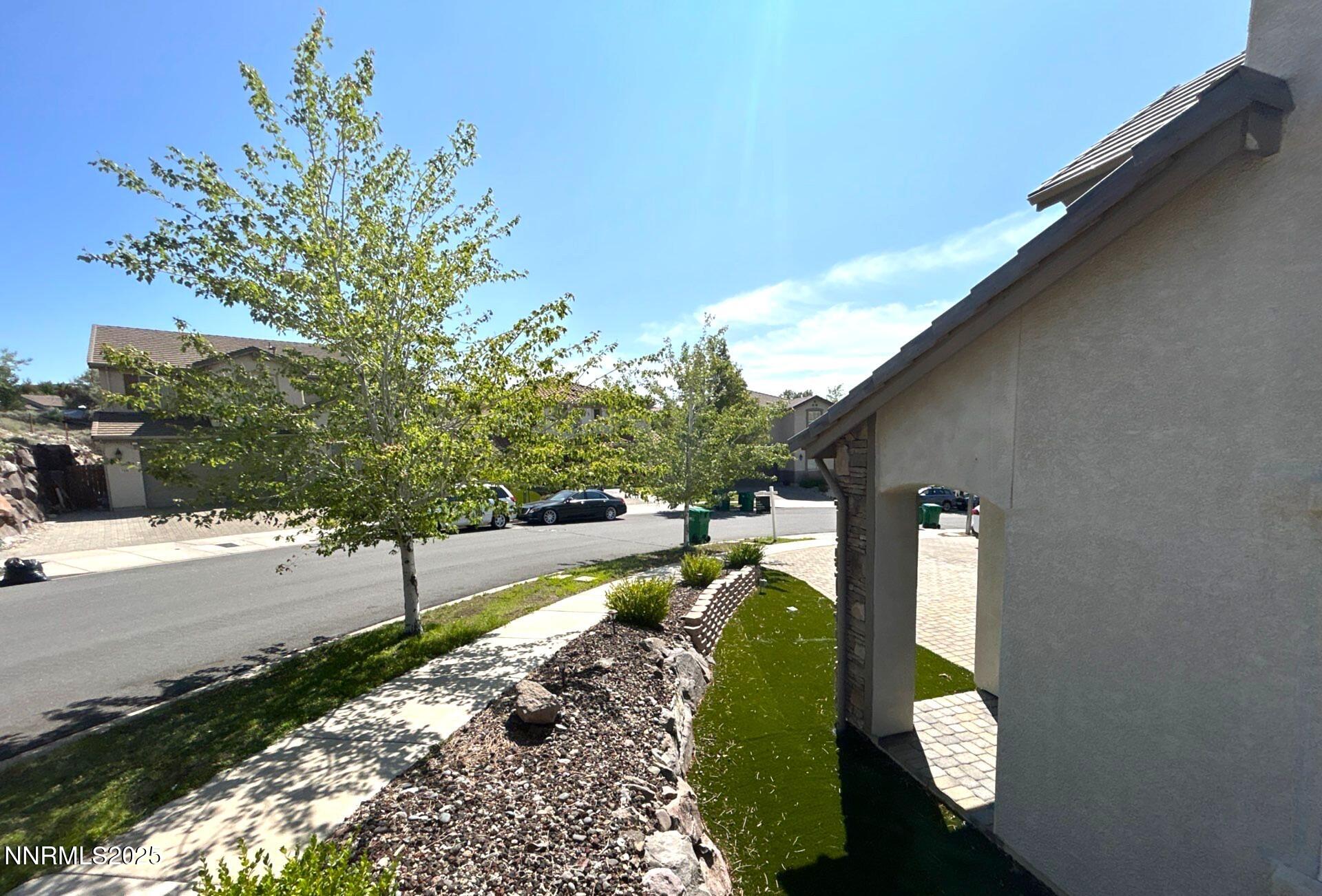 7150 Provence Circle Reno, NV 89523 - Photo 3 of 22 a backyard of a house with lots of green space