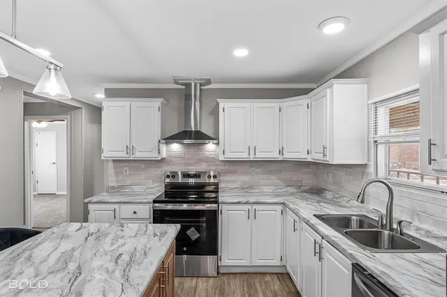 a kitchen with a table and chandelier