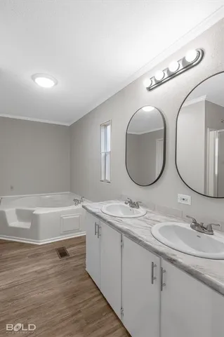 a bathroom with a sink double vanity and a mirror