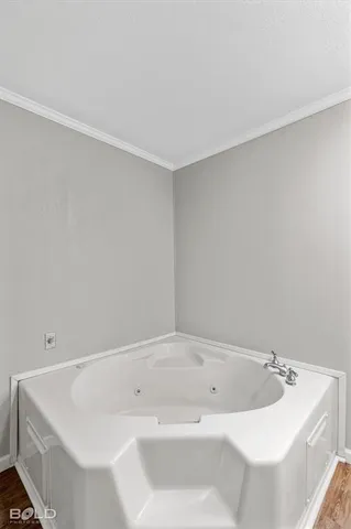 a view of an empty room with a ceiling fan and window