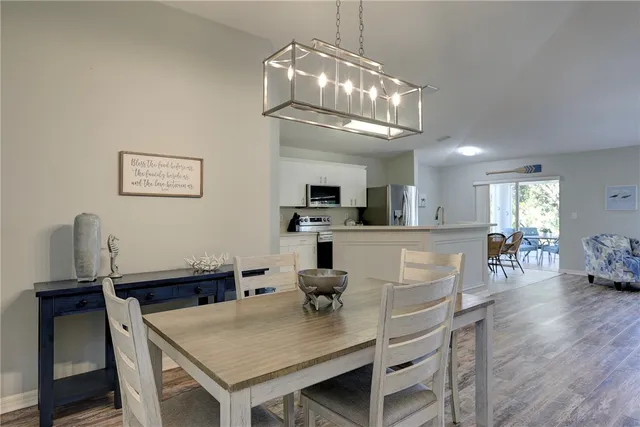 a view of a dining room with furniture window and outside view