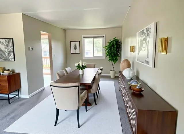 a view of a livingroom with furniture and a window